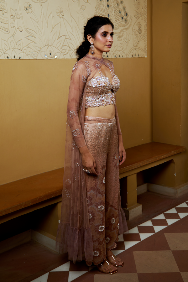 Side view showcasing the outfit’s layered structure, elegant drape, and detailed embroidery.