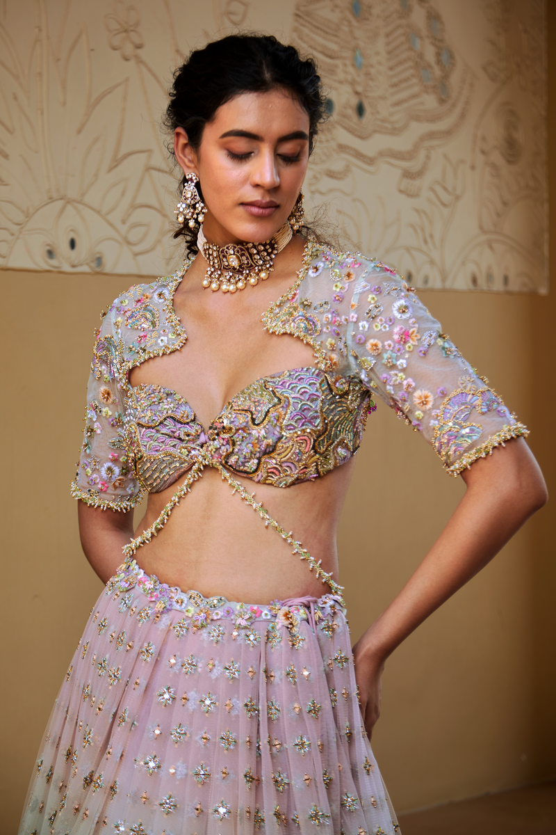 Raga Lehenga with Embroidered net blouse with a modern neckline and zip-back closure for bridal elegance.