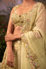 Detailed view of sage green sweetheart neckline blouse adorned with intricate nakshi, dabka embroidery, shiny sequins, and handcrafted embellishments.